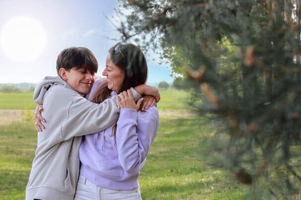 Parent Hugging teen