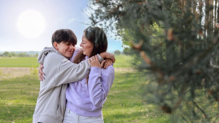 Parent Hugging teen