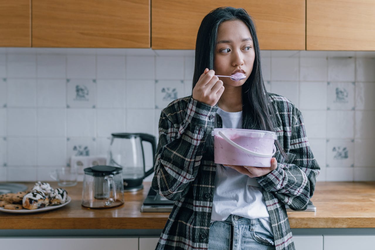 A young girl eating ice cream